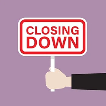 hand holding sign that says "closing down"